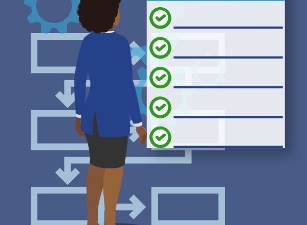 Woman standing looking at a checklist and flowchart